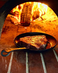 seared meat fire braai steel frying pan no chemicals camping nonstick 