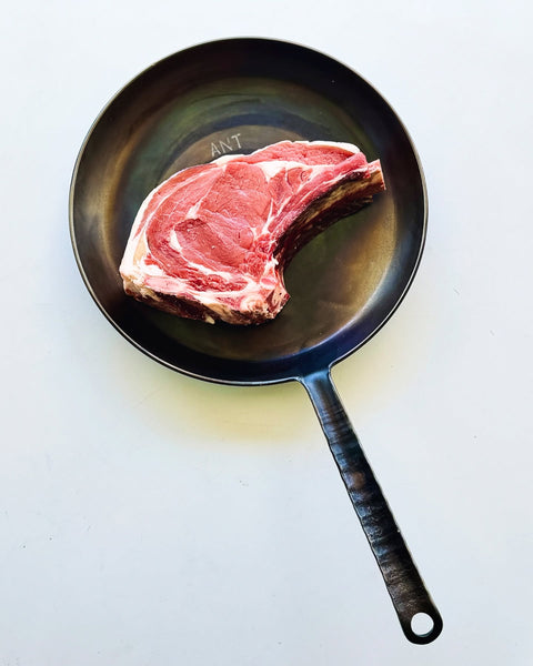 Steak steel pan seared heavy fire cooking heat regulation stamped initials braai south africa  